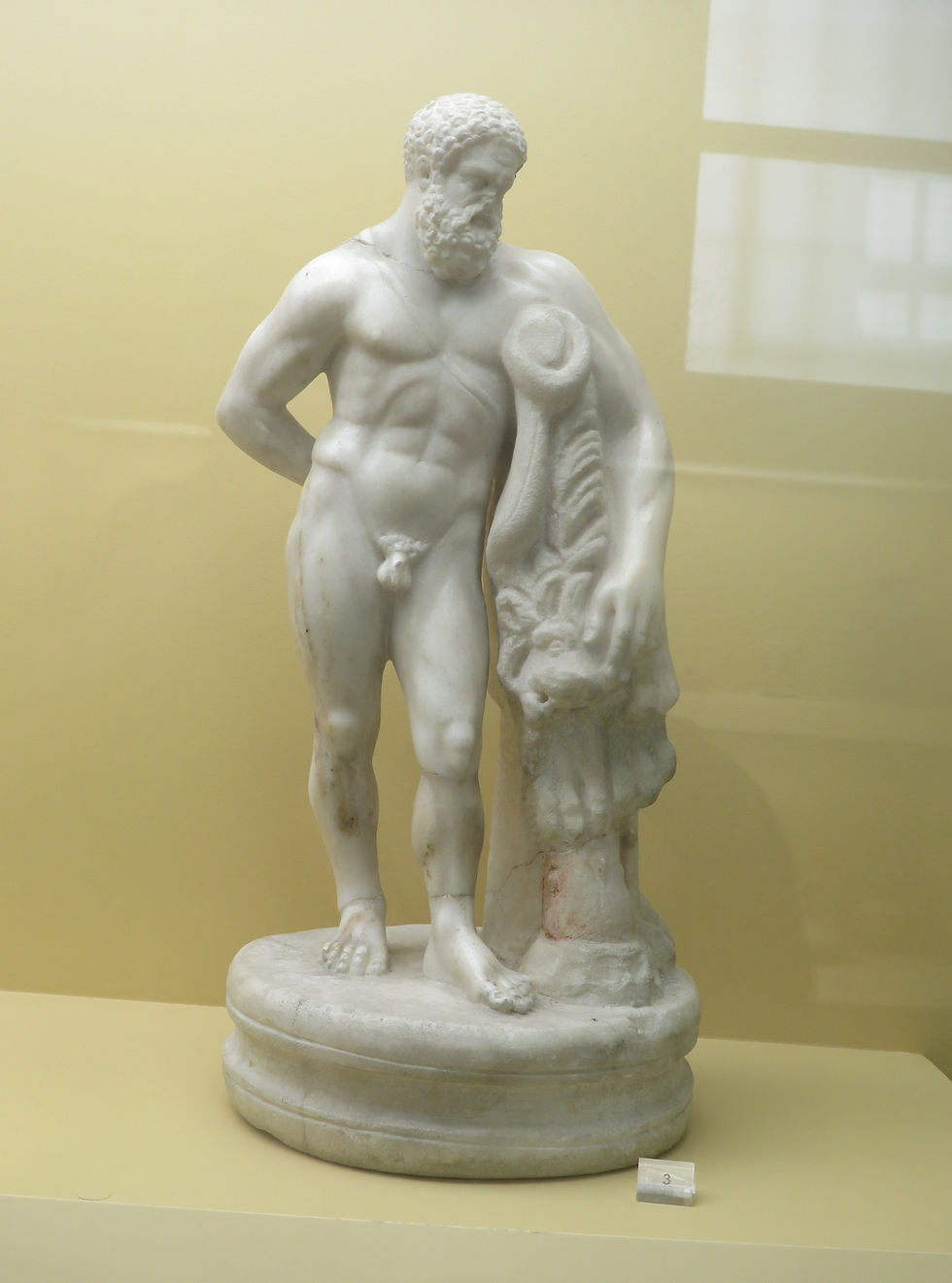 Small marble statue of Heracles housed in the Museum of the Ancient Agora of Athens.