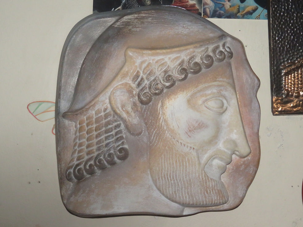 After returning from my trip, I was able to find a relief replica, based closely on the head of the real stele housed in the National Archaeological Museum.