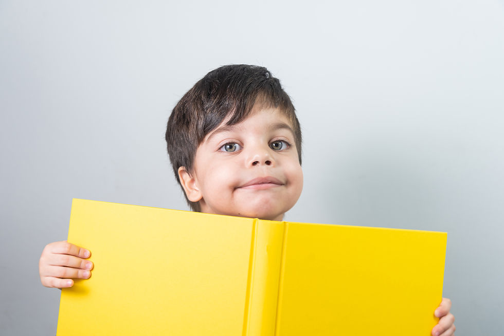 baby-boy-reading-yellow-book.jpg