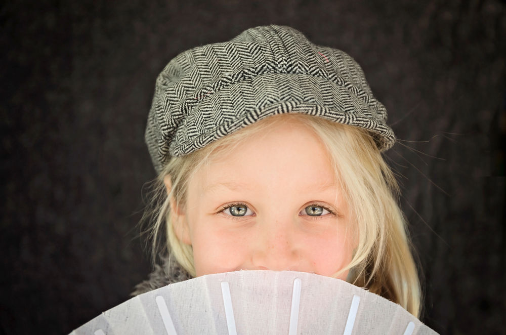 girl with fan and cap phot