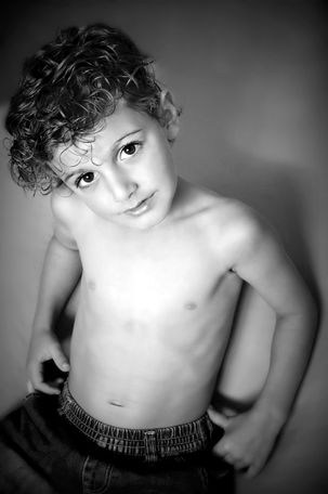 wistful pensive boy black and white photo