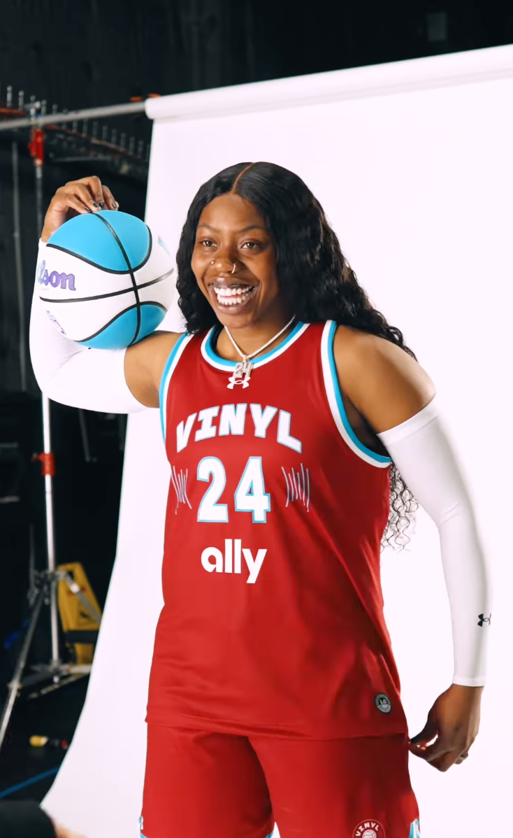 Arike Ogunbowale poses with a basketball in the Vinyl BC uniform for Unrivaled media day.