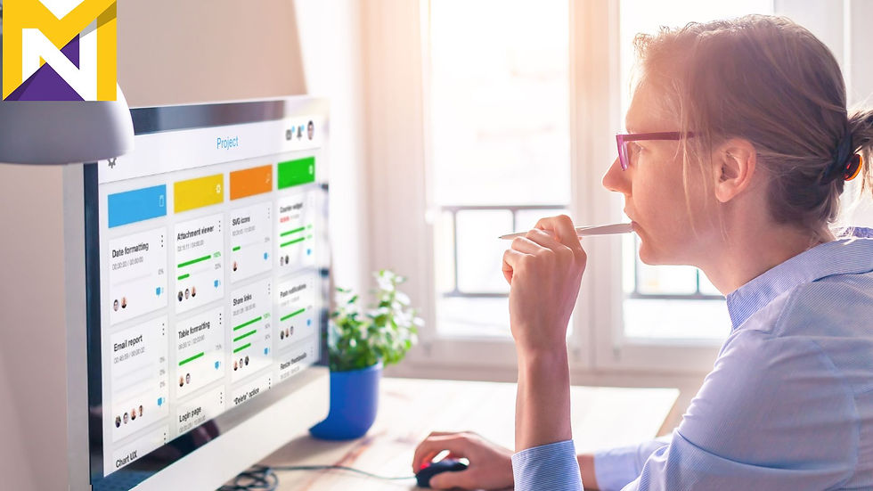 Person looking at computer screen with lean kaban system on it