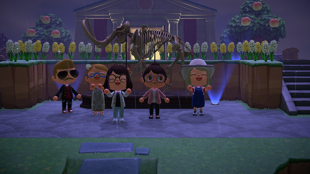 Animal Crossing players stand in front of a Mammoth skeleton that sits in front of the Museum