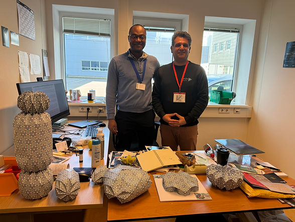 Dr. Advenit Makaya and Omid Hajishirmohammadi during an advisory session at ESA ESTEC in Noordwijk, surrounded by Omid’s geometric design models.