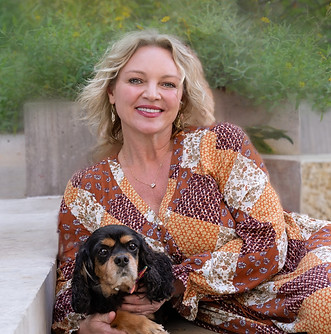 Master Stylist Jennifer posing with her dog 