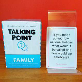 "Talking Point - Family" box beside a stand holding the card saying, "If you made up your own national holiday, what would it be called and how would we celebrate?"