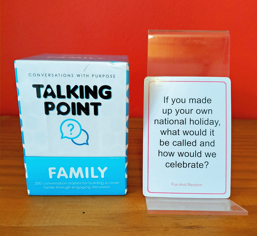 "Talking Point - Family" box beside a stand holding the card saying, "If you made up your own national holiday, what would it be called and how would we celebrate?"