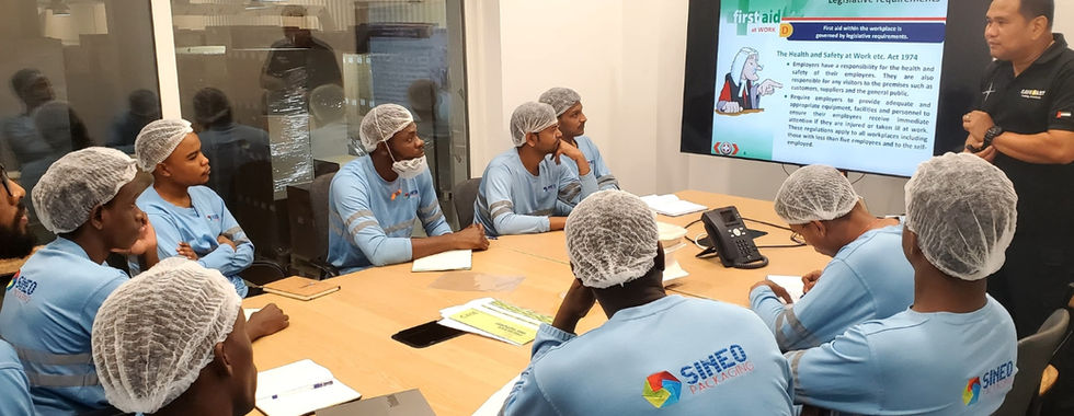 employee empowerment initiative showing a group of factory employees receiving first aid training sineo packaging