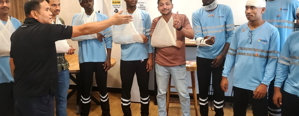 employee empowerment initiative showing a group of factory employees receiving first aid training at sineo packaging