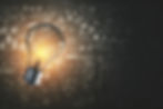 light bulb lighting up, in the background a board with mathematical calculations, expressing an idea or genealogy