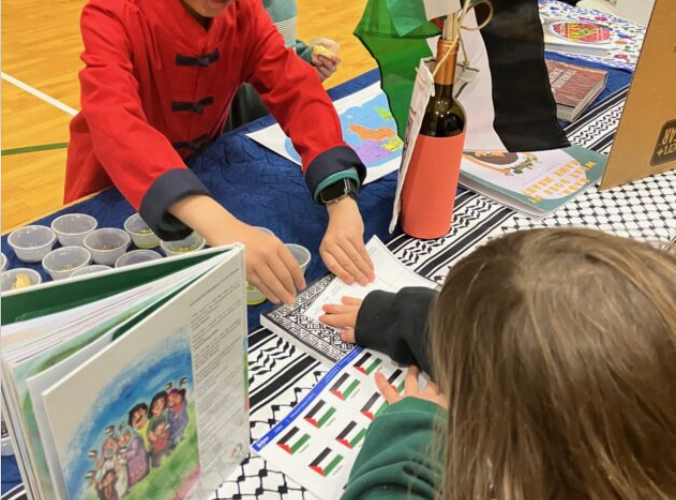 Heritage Night Display featuring indoctrination storybooks and terror-linked keffiyehs (May 2026)