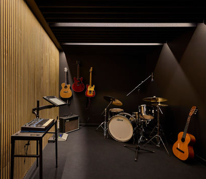 A home music studio with custom wood paneling and professional lighting design