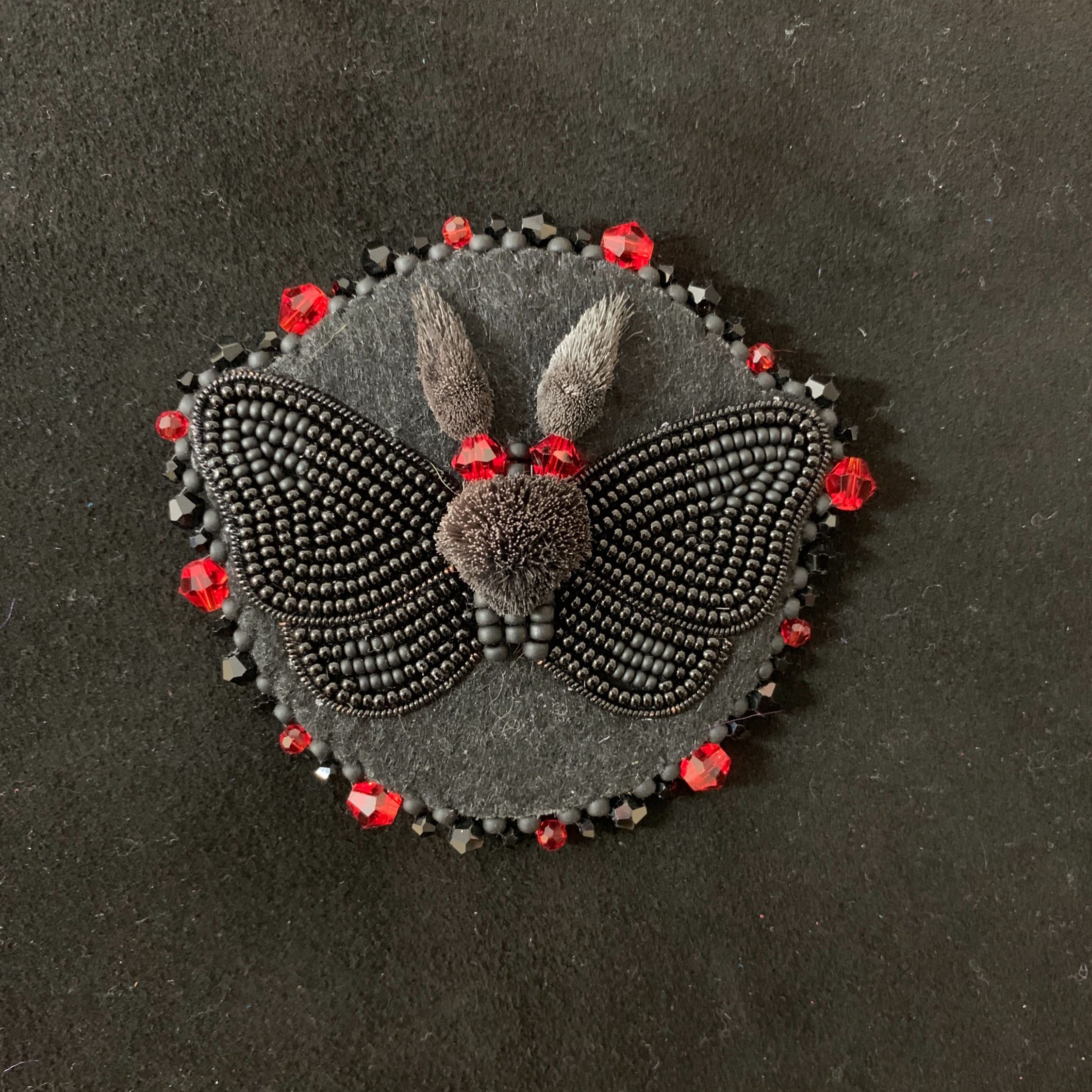 Mothman tufted brooch