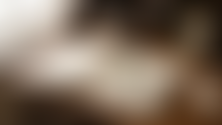 A vintage desk is adorned with an open sheet music book of Domenico Scarlatti's sonatas, accompanied by a magnifying glass and an antique key. Sitting beside a steaming cup of tea, a quill pen with an ink pot adds a touch of old-world charm, while a small portrait and a tag reading "Beyond the Notes: Unlocking Scarlatti's Charm" complete the elegant setting.