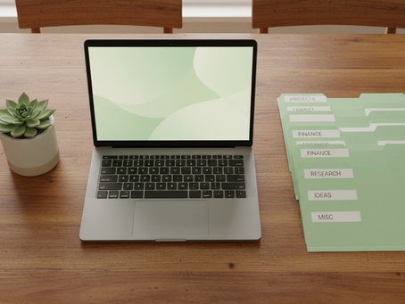 April Kelly, independent virtual assistant, organizing digital files and workflows on a laptop.