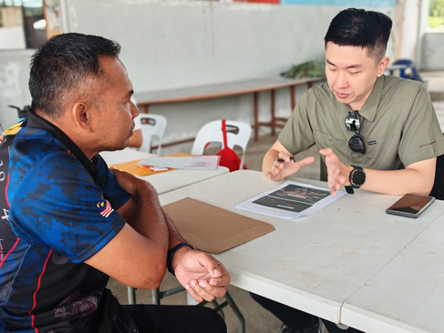 Sam engaging with rural villager to understand their community's water issue
