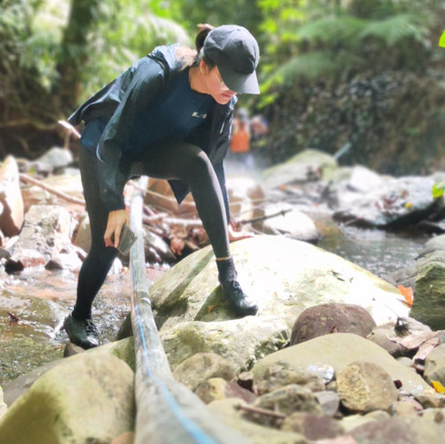Girl crossing through the rocky paths