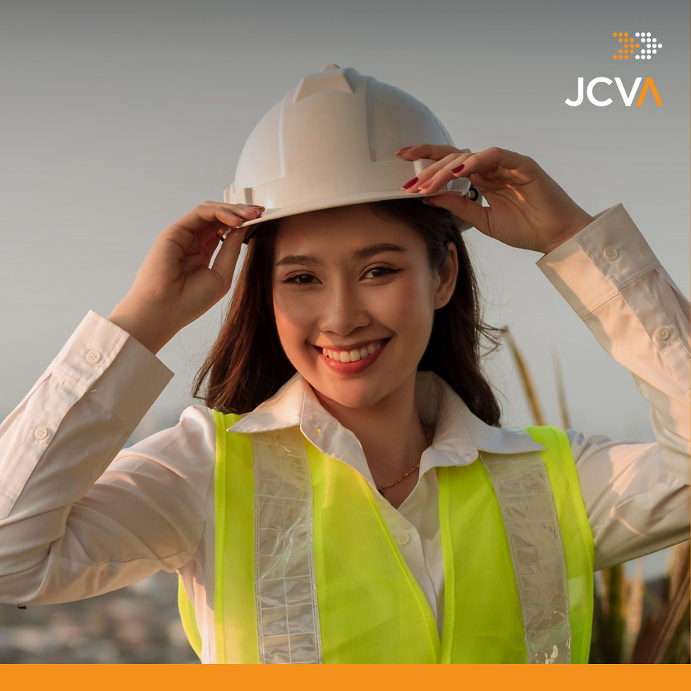 woman in a yellow-green vest and white hard hat