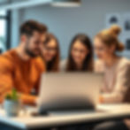 A team of user experience designers designing their laptop creating a website and add wome