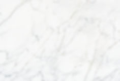 close-up-white-marble-textured-wall.jpg