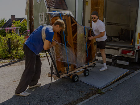 movers loading furniture onto a moving truck