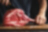 butcher-cuting-fresh-appetizing-tomahawk-steak-old-wooden-board-closeup_1220-6590.jpg