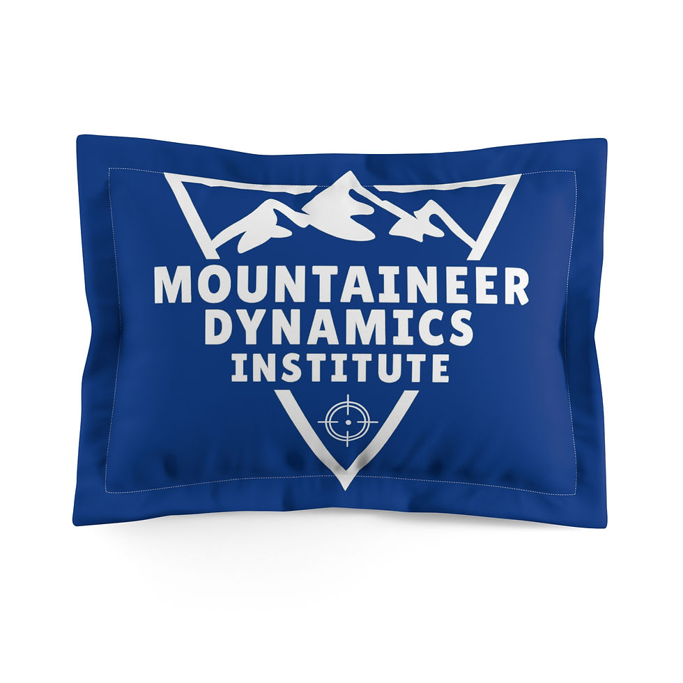 Blue pillow with white Mountaineer Dynamics Institute logo on the front.