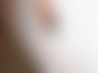 termite inspector listening to wall for possible termites inside