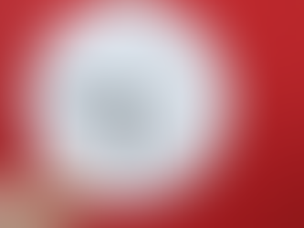 a hand holding a white clock