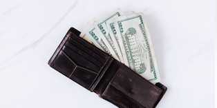 wallet with a pile of money
