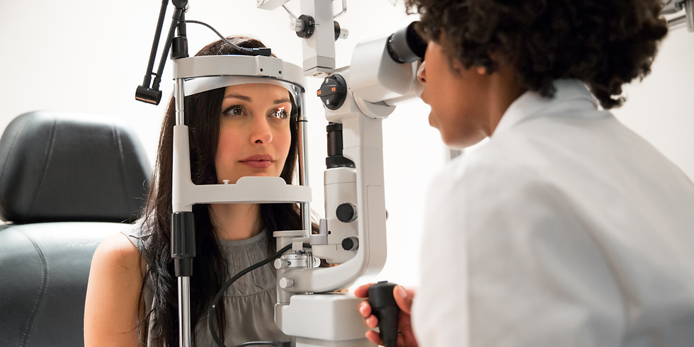 woman undergoing eye exam by optometrist
