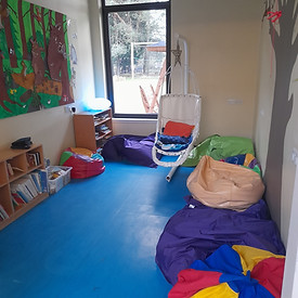 Quiet room with comfy swing chair and books