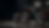 Red and black custom chopper in a dark workshop