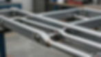 Custom truck-bed bracing with welded tube structure for strength and fitment.