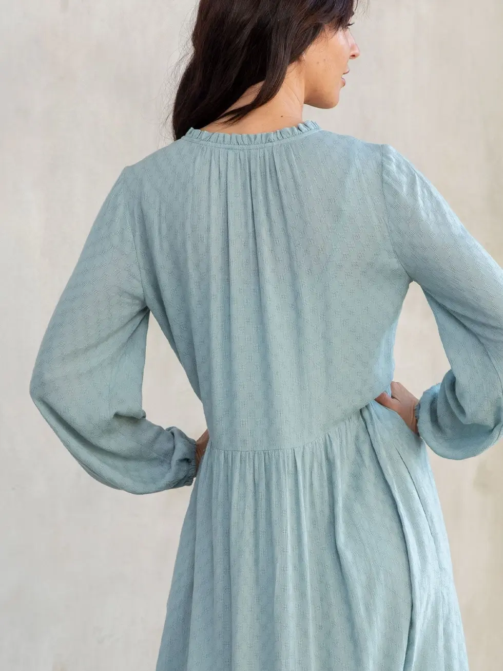 Modest checkered maxi dress with long sleeves and pockets