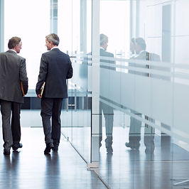 Business Meeting of Two Men Walking in the Hall