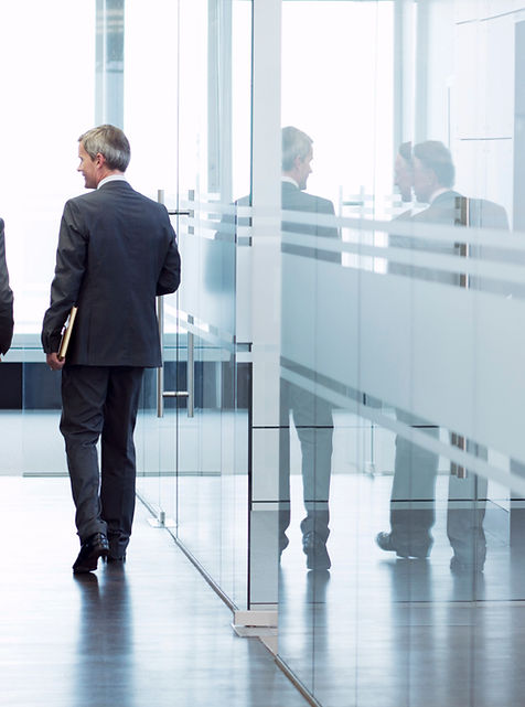 Business Meeting of Two Men Walking in the Hall