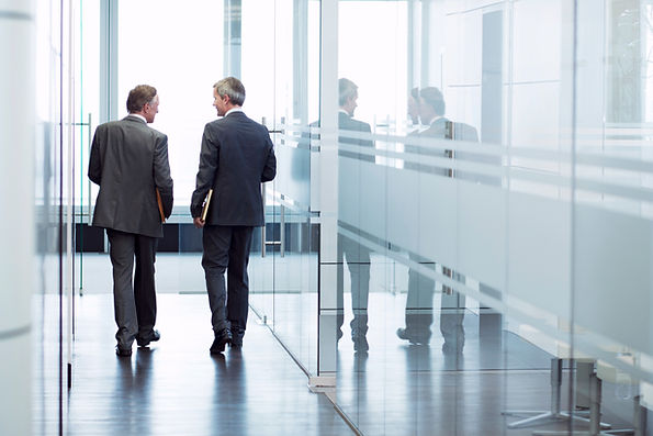 Two lawyers walking down hallway