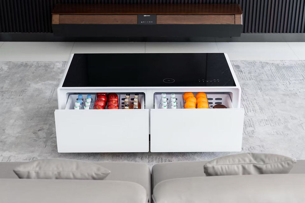 White coffee table with open drawers revealing drinks and fruit, set in a modern living room with a black TV stand and beige sofa.