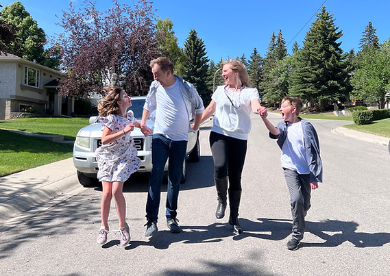Dan Olesen with his wife Erin and their two children, representing his role as a dedicated family man in Ward 1