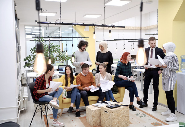 Diverse group of professionals in a shared workspace representing Ward 1’s population diversity