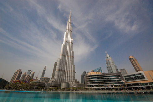Dubai skyline at dusk with high-rise buildings, representing a prime location for business setup.