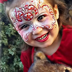 Holiday airbrushing for face and arms at Unleash the Holidy Cheer. Photo is a stock photo of artwork sample.