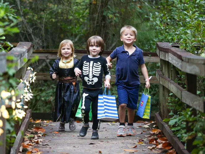 Young trick or treaters make their way around the trail during the annual Oatland Island Halloween Hike on Friday, October 13, 2023. Richard Burkhart/Savannah Morning News