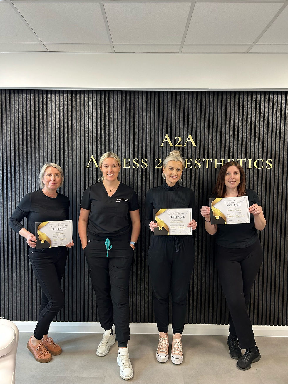 Delegates with their Access 2 Aesthetics training certificates