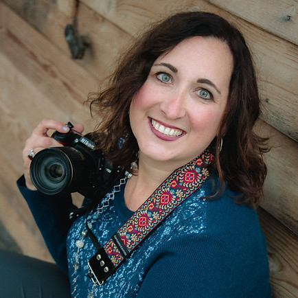 photographer posing with her camera