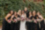 Bridal Party In Front of Ivy Wall