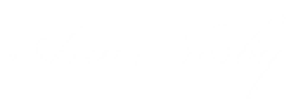 Ann Nesby logo in all white letters on transparent background