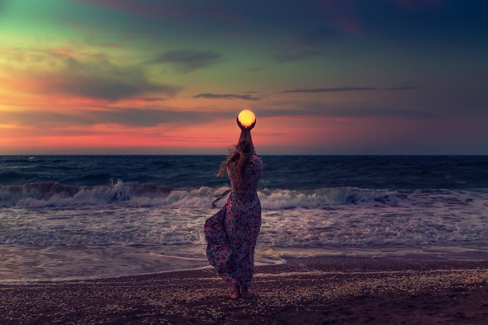 The girl holds the moon in her hands. Beautiful sunset on the sea. Dreams come true. Every